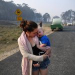 20838532-7674979-Nervous_wait_Wytaliba_resident_Storm_Sparks_holds_her_son_Zeke_B-a-23_1573525183773